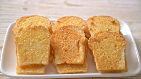 baked-crispy-bread-with-butter-and-sugar