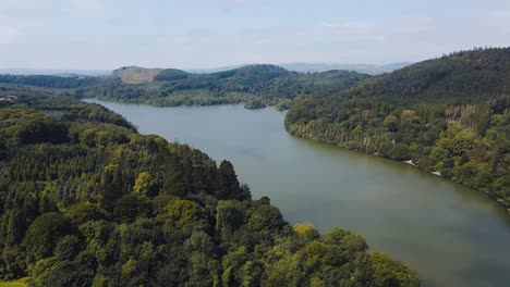 Panning-aerial-view-of-Castlewellan-Lake-and-Forest-Park,-County-Down