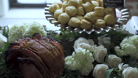 Appetizing-food-laid-out-at-wedding-party-butternut-biscuits,-honey-roast-ham
