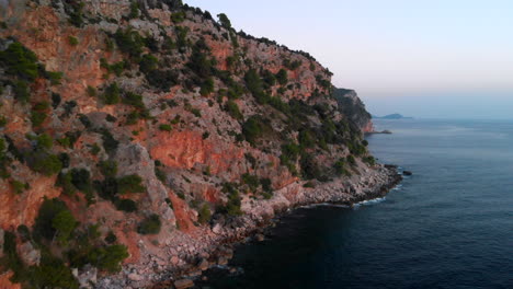 Rugged-secluded-Croatia-coastal-bay-on-Adriatic-Sea,-sunset-aerial-view