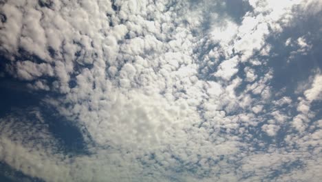 Fluffy-cloud-sky-above-on-a-sunny,-summer-day,-in-Los-Angeles,-California---Pan-view