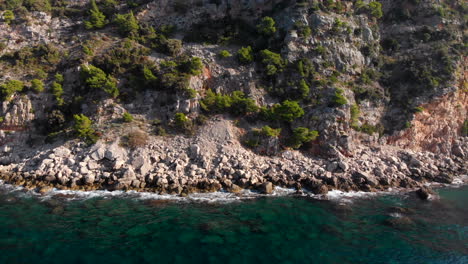Rugged-coastline-on-Adriatic-sea-coast,-Croatia,-aerial-arc-shot