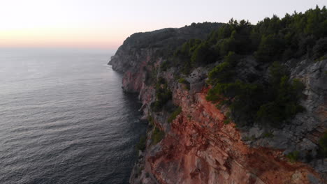 Croatian-coastal-cliffs-on-Adriatic-Sea-at-sunset,-aerial-view