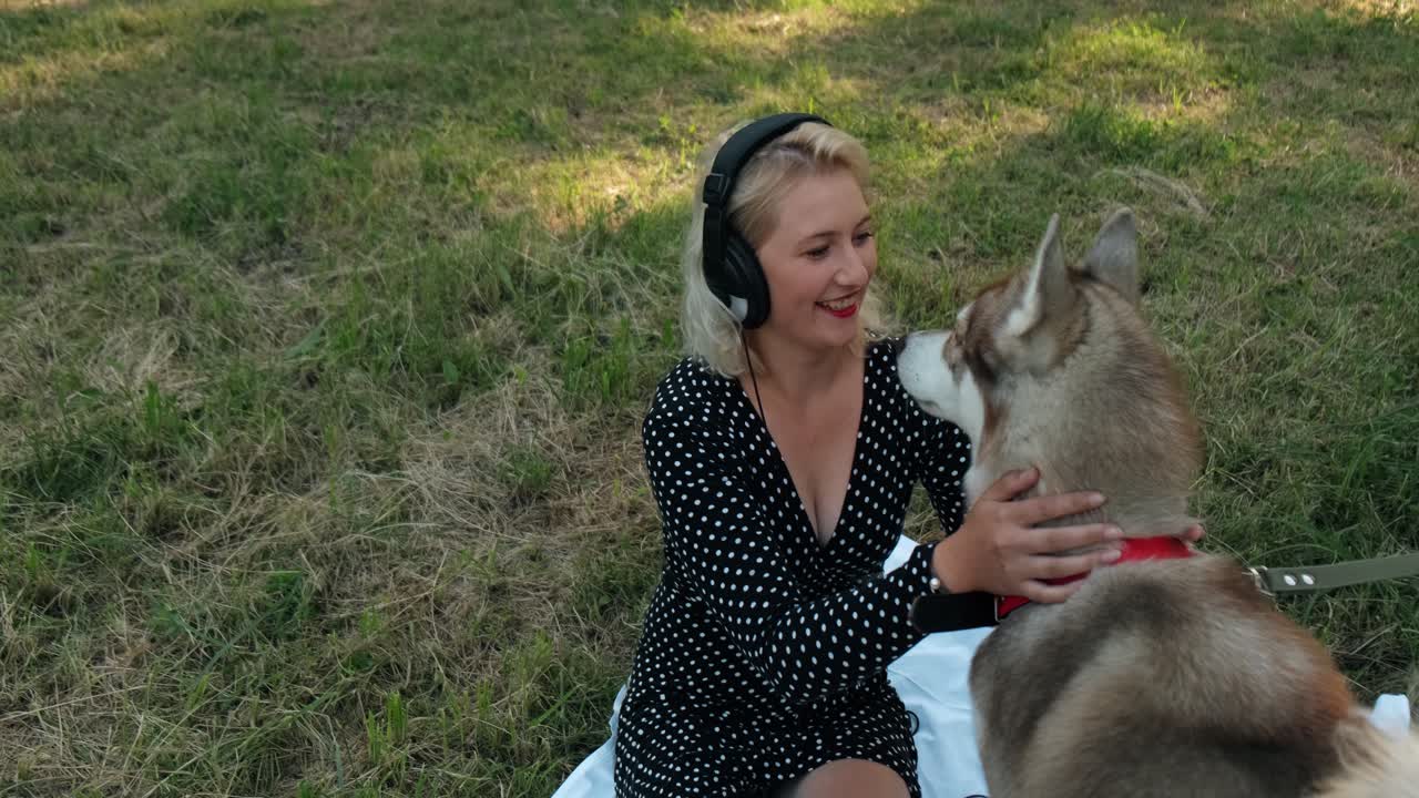 Dog Girlsexivideo - Premium stock video - Girl in the park playing with a dog