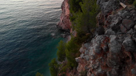 Amazing-Croatian-coastline-cliffs-at-sunset,-aerial-view