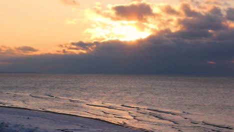 Colorful-Winter-Sunset-on-the-Shore-of-the-Gulf-of-Riga-in-Latvia-Saulkrasti-White-Dune