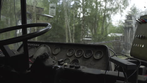 Panning-closeup-shot-of-Vintage-Bus-dashboard-interior-in-dark-forest