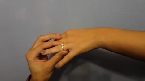 Close-up-female-hand-getting-engagment-ring-on-her-finger-from-boyfriend