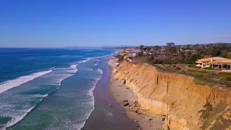 Slow-motion-aerial-footage-around-the-bluffs-and-beaches-of-Del-Mar,-California