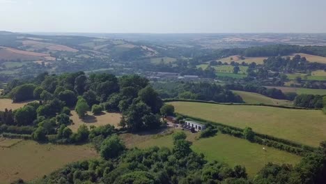Exploring-the-lush-English-countryside-on-a-summer-day,-AERIAL