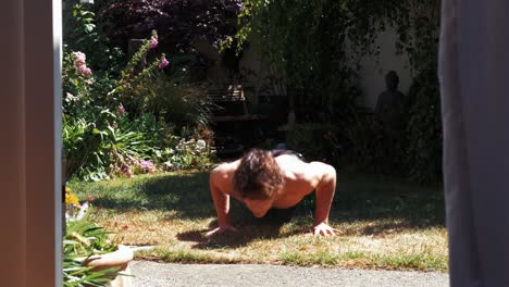Backyard-workout-young-man-doing-push-ups