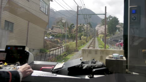 View-of-the-pilot-in-a-small-mountain-train-in-japan