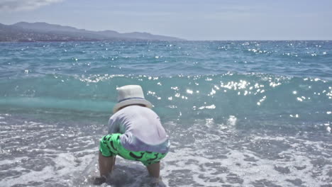 Three-Years-Old-Child-Enjoys-The-Sea-At-Kalamata-Beach-Greece-SLOW-MOTION