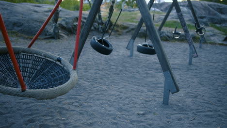 Empty-playground-swings-swinging