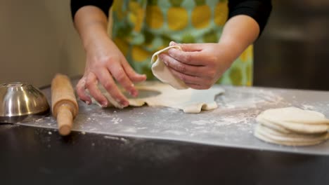 Cutting-out-empanadas-from-dough