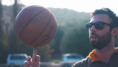 Spinning-basketball-on-finger-in-slow-motion-shallow-depth-of-field-HD-60fps