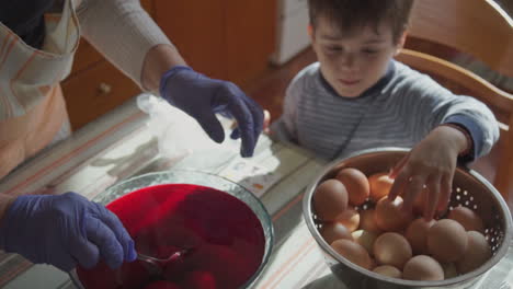 Footage-Of-Family-Painting-Easter-Eggs-In-A-Greek-Village-Indoors