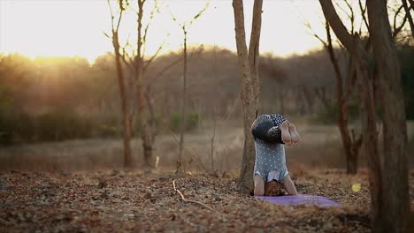 young-womans-doing-yoga,Concentrated-woman-meditating-in-nature