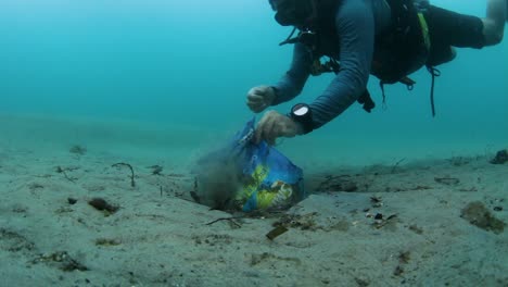 A-scuba-diver-removing-rubbish-from-the-ocean