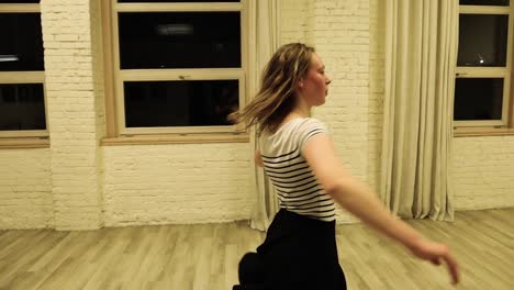 Teenage-female-dancer-spinning-around