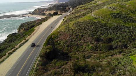 Aerial-of-Motorcyclist-Riding-on-California-Coast-Highway-One