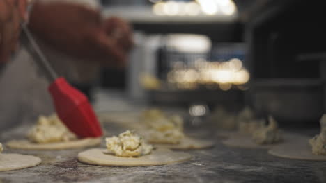 CLOSEUP-footage-of-cooks-preparing-panzerotti-at-italian-restaurant