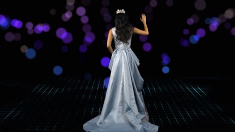 Miss-beauty-pageant-winner-steps-across-the-stage-with-scrolling-lights-and-waves-to-the-audience---rear-view-bokeh-background