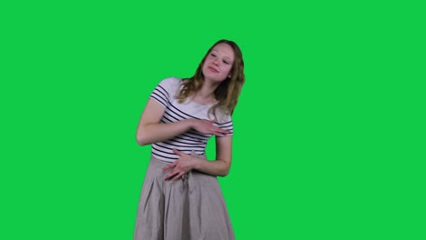 Happy-teenage-girl-dancing-in-front-of-a-green-screen