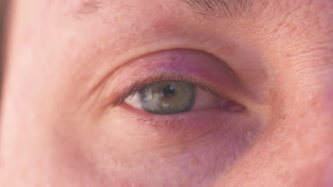 Close-up-of-a-woman's-blue-eye,-no-makeup