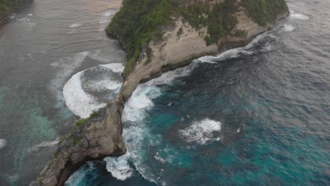 Rough-sea-waves-breaking-on-the-tiny-cliff-connecting-two-uninhabited-island