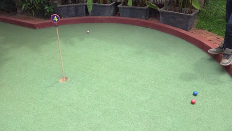 Players-Having-Fun-on-the-Green-at-the-Mini-Golf-Course