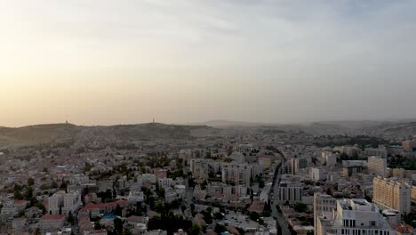 Aerial-fly-down-shot-of-Jerusalem-city-center-overview-at-sunset