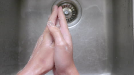 Person-Cleaning-His-Hands-With-Soap-To-Prevent-Corona-Virus---Close-Up-Shot