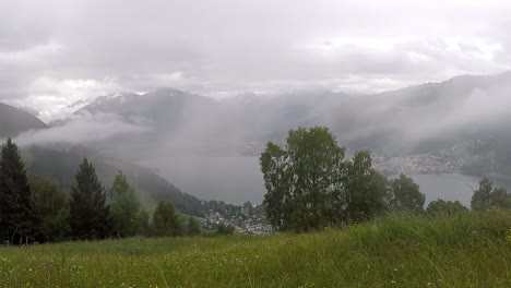 Timelapse-of-the-view-of-Zell-am-See-and-the-Zeller-See-that-looms-through-the-rising-fog