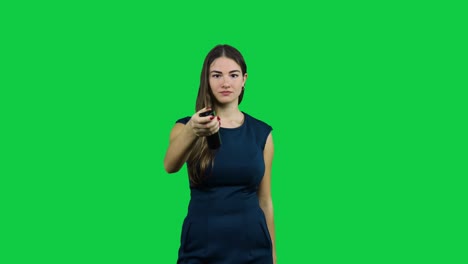 Girl-usees-a-broken-TV-remote-in-front-of-a-green-screen