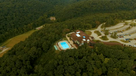 tilting-down-drone-shot-of-Shawnee-State-Park-building-with-pool