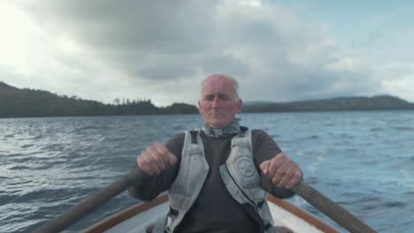 Fisherman-rowing-on-rough-lake-REAL-TIME