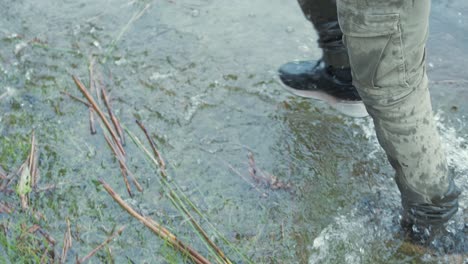 Refugees-walks-through-river-in-Europe,-Slow-motion-Feet