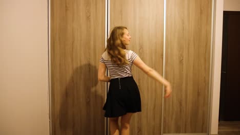 Girl-practices-dancing-in-her-room-by-her-own