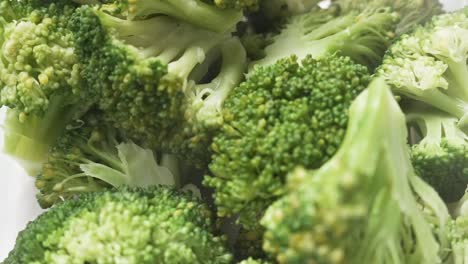 Close-up-shot-of-boiled-broccoli,-isolated-on-white-background-whth-steam-showing-120fps