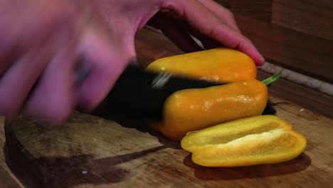 Male-Chef-Chopping-a-Fresh-Yellow-Bell-Pepper