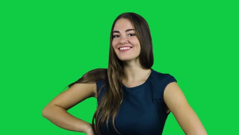 Happy-smiling-flirty-girl-in-front-of-a-green-screen