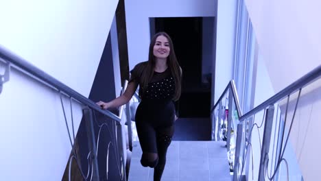 Female-dancer-walking-up-the-stairs-view-from-the-front