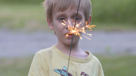 Cute-little-boy-holding-a-sparkler