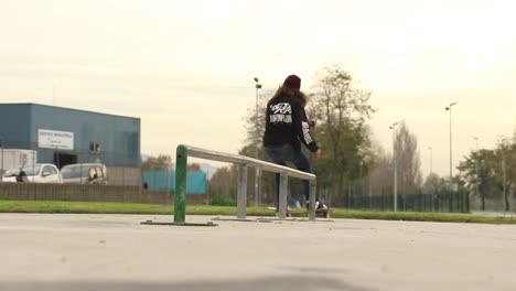Skater-makes-grind-FS-Feeble-Three-Sixty-Out-on-Rail-in-an-old-Skatepark-in-Slowmotion