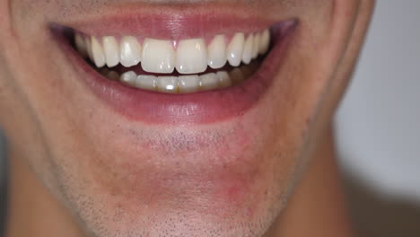 Clean-Shaven-Male-Extreme-Close-Up-of-Straight-White-Teeth-Mouth-Licking-Lips-and-Smiling-to-Camera
