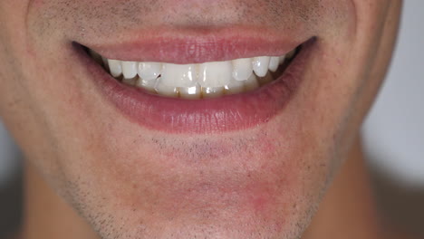 Extreme-Close-Up-of-Mouth-with-White-Straight-Teeth-Laughing-to-Camera