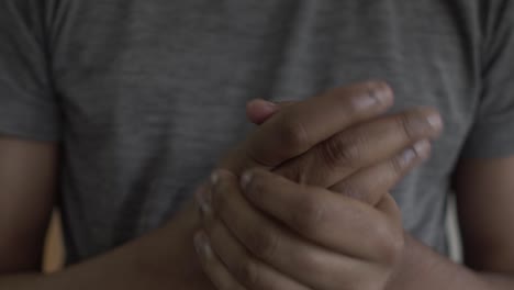 Close-Up-Of-Adult-Asian-Male-Rubbing-Hands-Together