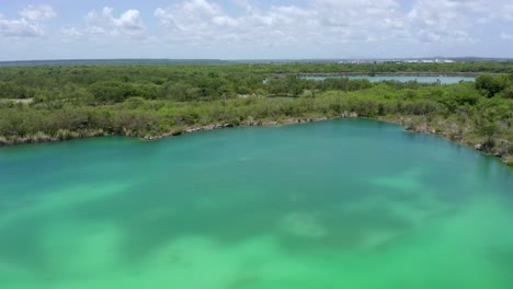 Aerial-circling-of-Blue-lake-in-Cap-Cana