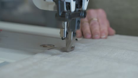 Sewing-ends-of-curtains-running-fabric-through-sewing-machine